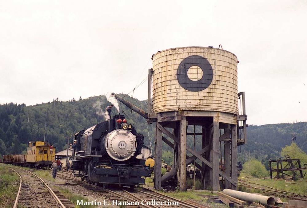 On May 7 of 1961, Coos Bay #11 takes on water and oil outside the shops at Powers, OR in preparation for taking a group of Boy Scouts on a train ride. Photo by R. E. Burke - Martin Hansen Collection.