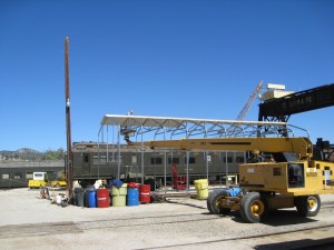 Erecting the carport frame and attaching roof panels  