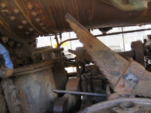 Front, left spring hangers removed from the spring.  You can see the front, right assembly in the background 